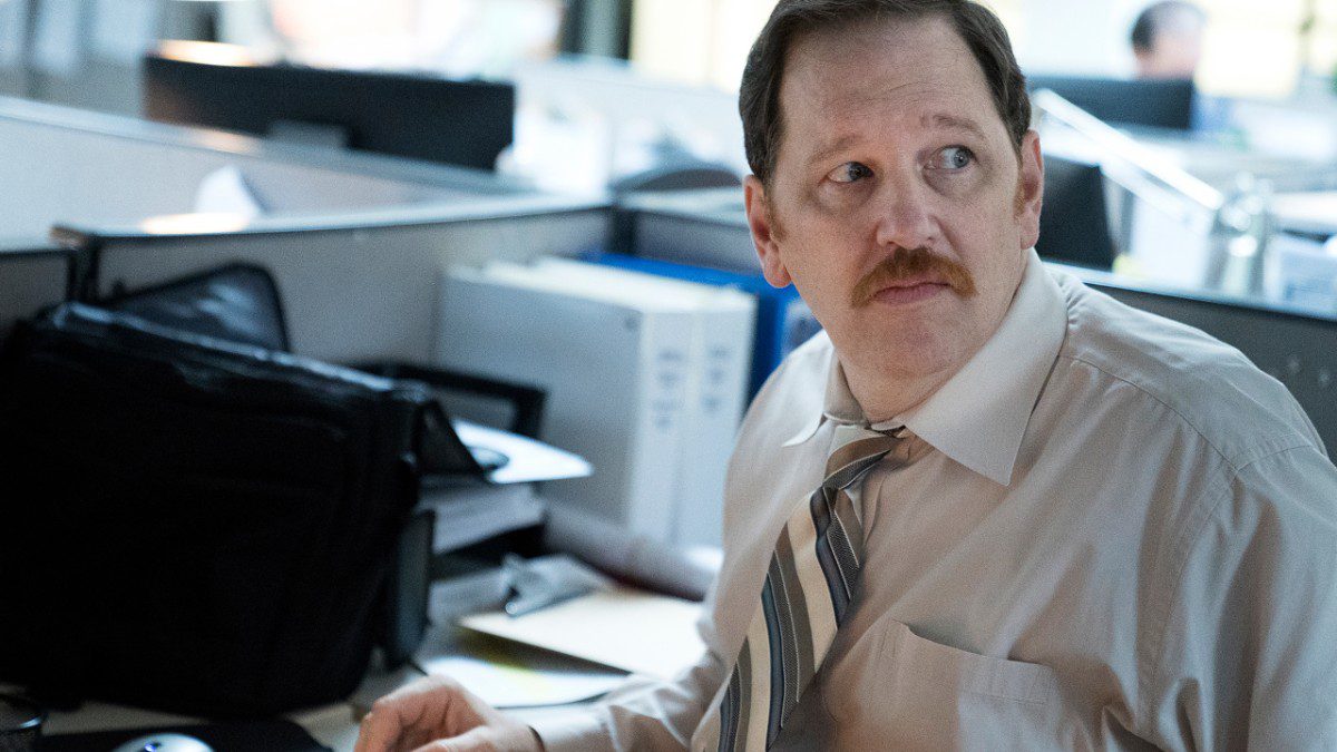 Loach, at his desk, with a look of concern on his face.