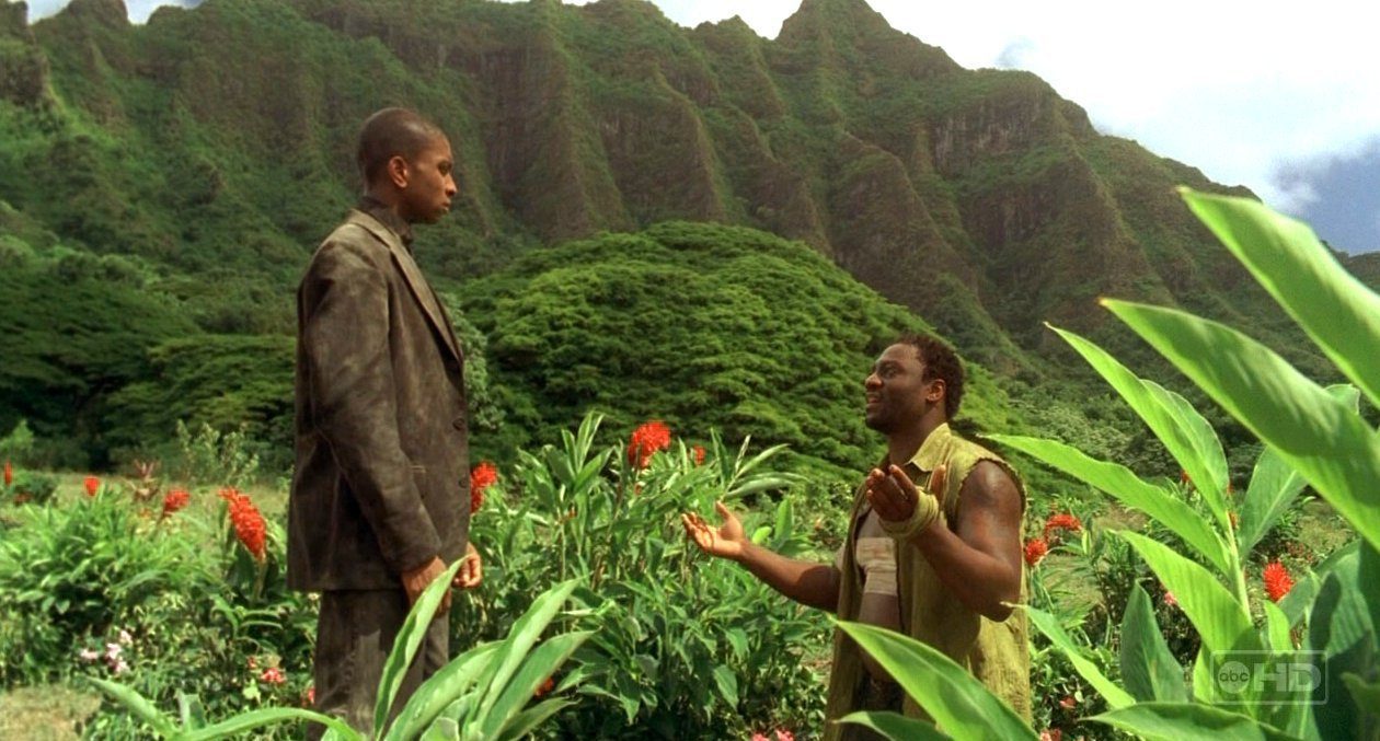 Mr. Eko kneels in front of the Smoke Monster version of Yemi 