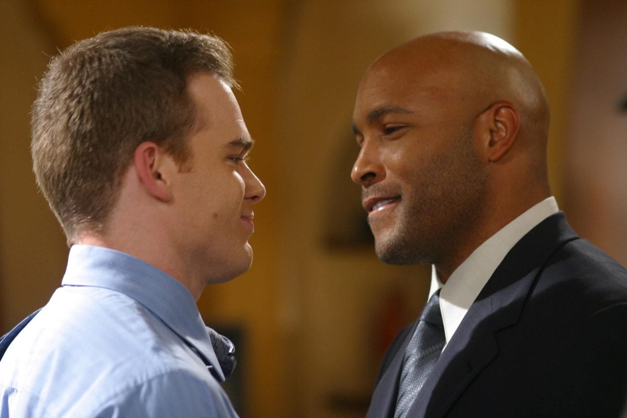 Keith and David stare and smile at each other in Six Feet Under