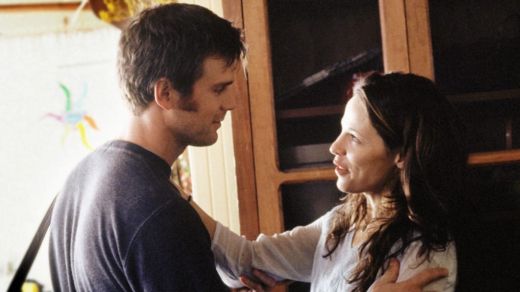 Nate and Lisa embrace as they speak in Six Feet Under
