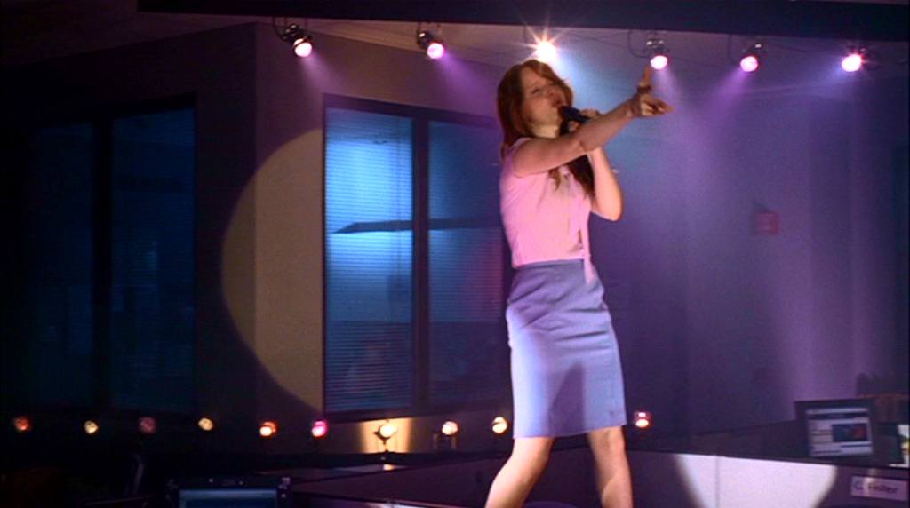 Claire daydreams of singing in her office in Six Feet Under