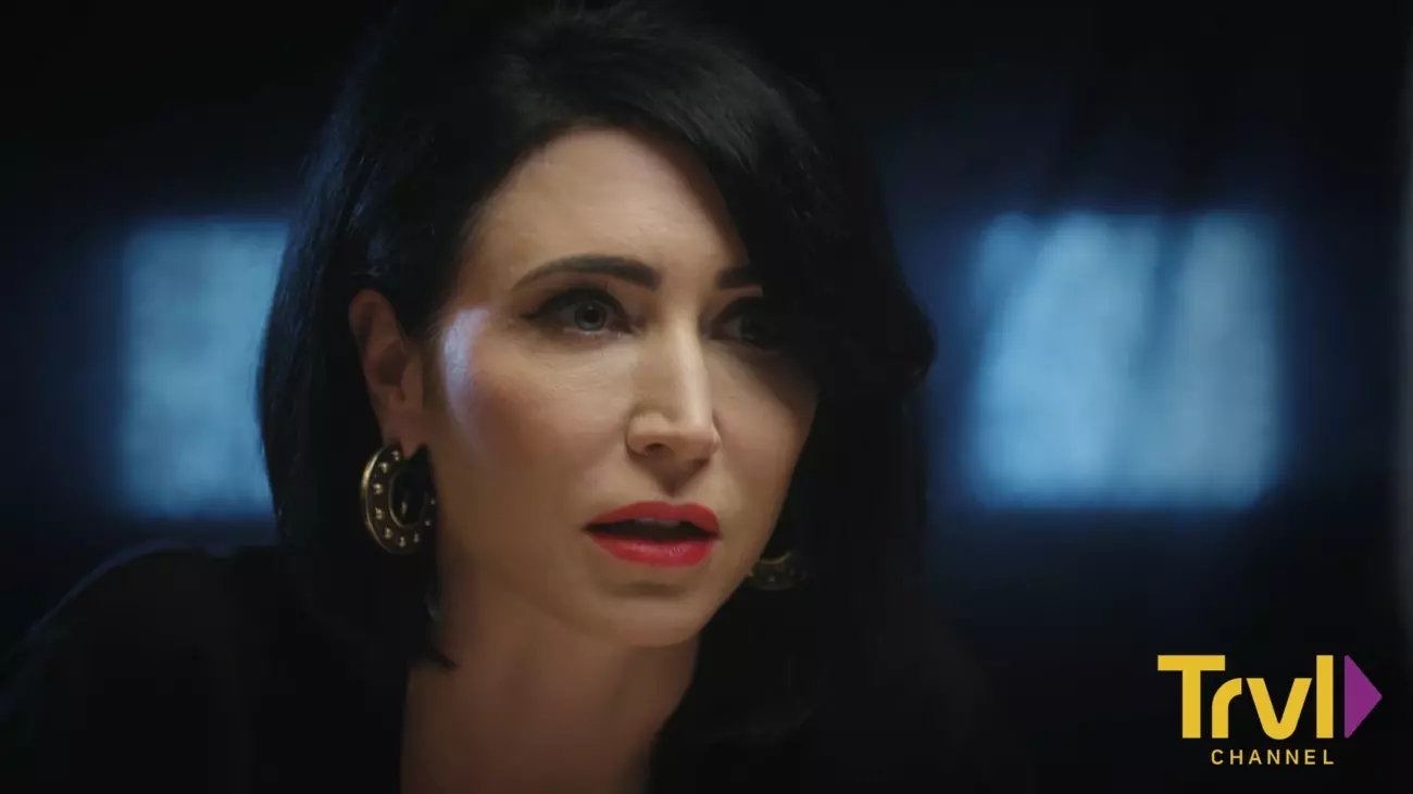 Cindy Kaza leans forward on The Dead Files