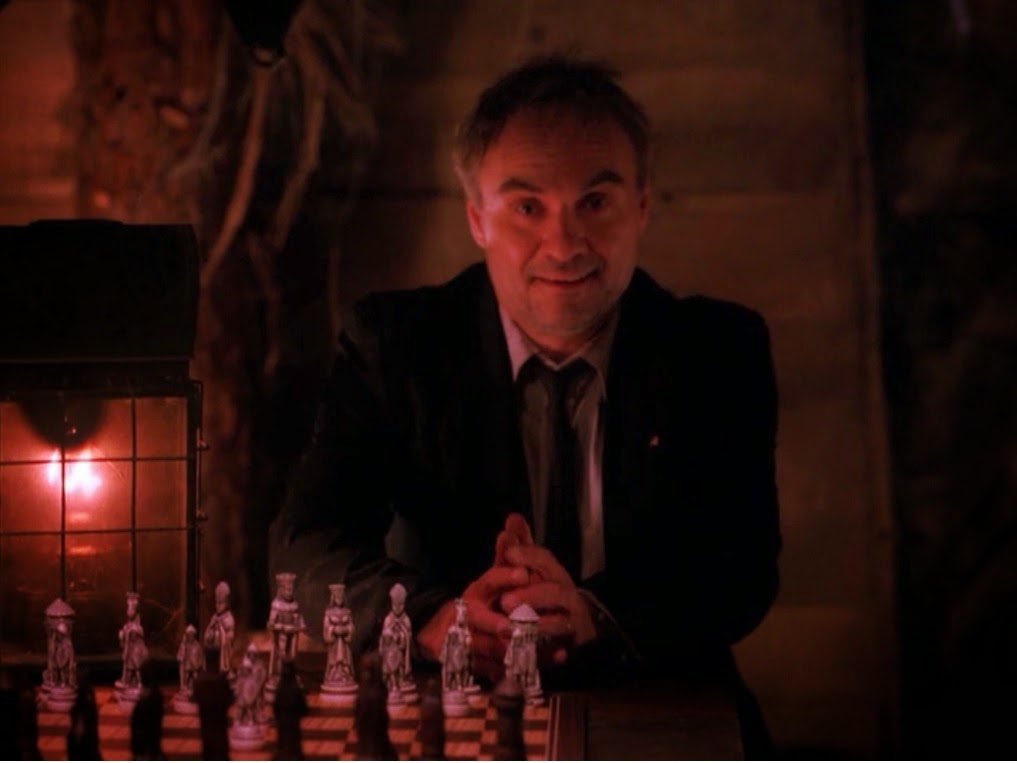 Windom Earle sitting at a chess board.