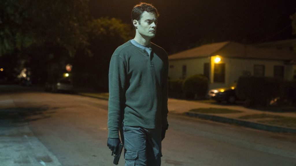 Barry walks down the street with a gun in the Barry pilot episode. 