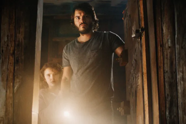 A man looks into a basement in Freaks