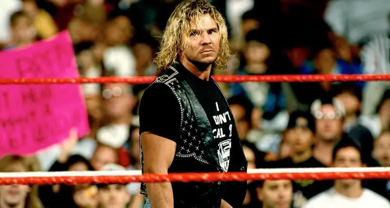 Brian Pillman stands in the middle of the ring