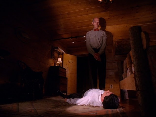 The Giant stands over an injured Agent Cooper